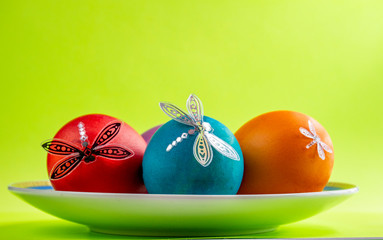 Easter, easter eggs on a saucer.
