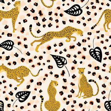 Cheetahs with palm tropical leaves seamless pattern. Trendy style of wild cats in different poses surrounded by rough skin motifs and bizarre foliage. Exotic art backdrop.