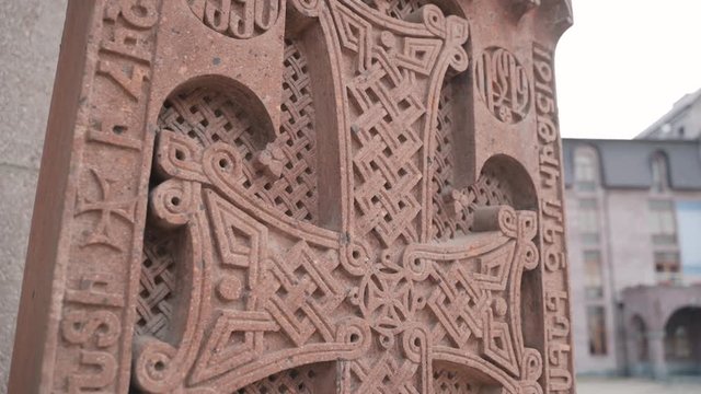 The cross in stone on the territory of the Armenian Church is undoubtedly one of the best examples of medieval Armenian architecture . Patterns are carved on the cross.
