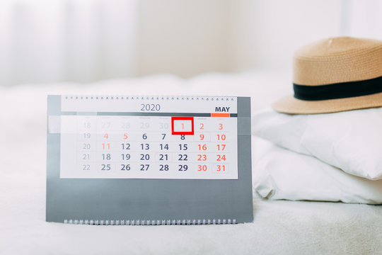 When quarantine is over, 2020 calendar, hat and white pillows on the bed, summer 2020 vacation