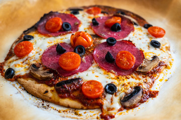 Margherita pizza on baking paper
