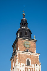 Fototapeta na wymiar City Hall Tower at main Market Square in center of Krakow, Poland