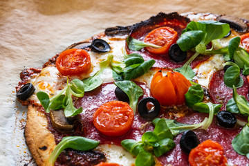 Margherita pizza on baking paper
