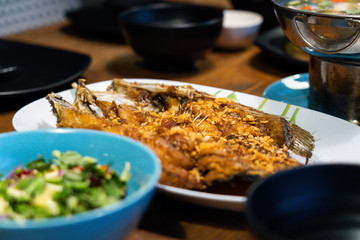Fried fish on the plate.