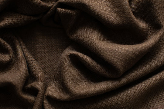 Texture of brown linen fabric background