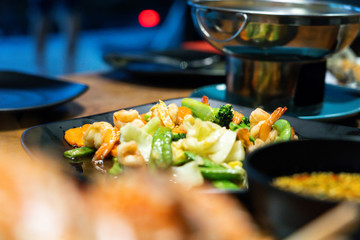 Fried vegetables on the plate.