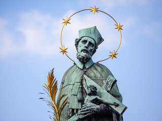Sculpture of John of Nepomuk on the Charles bridge in Prague