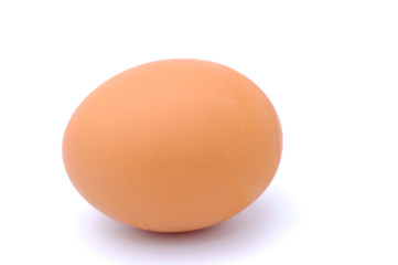 Close-up view of raw chicken eggs on background