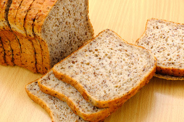 Fresh homemade baked bread and sliced bread isoalted on white background
