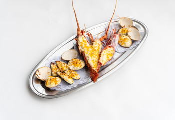 An assortment of baked seafood with cream and cheese