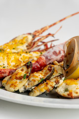 An assortment of baked seafood with cream and cheese