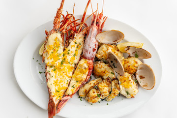 An assortment of baked seafood with cream and cheese