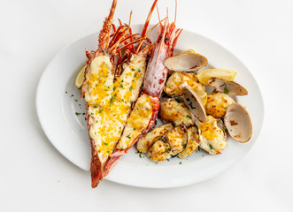 An assortment of baked seafood with cream and cheese