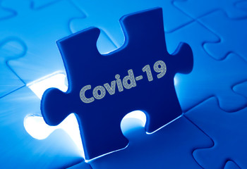 Fototapeta premium puzzle with Covid-19 words