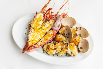 An assortment of baked seafood with cream and cheese