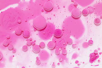 Fluid art texture. Background with abstract mixing paint effect. Liquid acrylic picture with artistic mixed paints. Can be used for baner or wallpaper. Pink and white overflowing colors