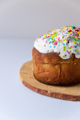 Glazed easter cake  on white marble background. Traditional food 