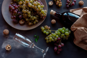 Romantic dinner red wine and grapes top view