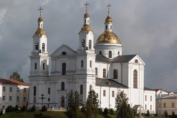 white church with golden domes