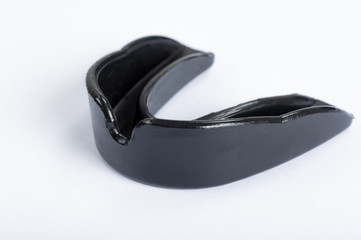 A black gumshield on a white background
