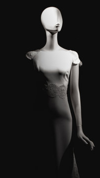 Eyeless noseless hairless white mannequin in bride dress with black background