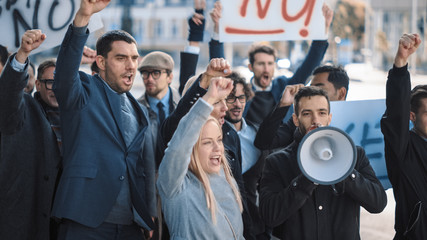 Multicultural Diverse Office Managers and Business People Picketing Outside on a Street. Men and...