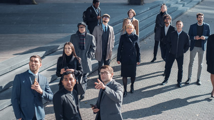 Multicultural Diverse Office Managers and Business People Suddenly Stop on the Street and Look Up....