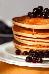 
pancakes with blackcurrant berries and syrup