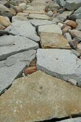 Close-up of a natural stone gangway / walkway between stones
