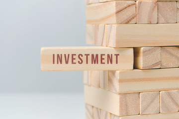 Investment concept - wooden blocks with text on a white background.