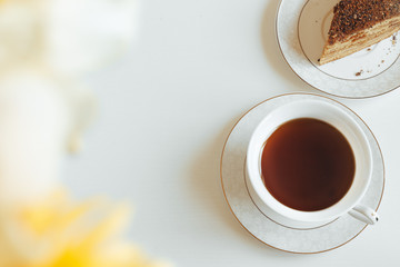 Tea in a white mug close-up on a white background