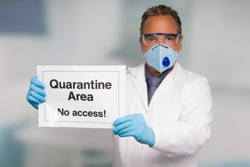 Doctor with medical face mask and medical gloves showing quarantine sign in front of a restricted...