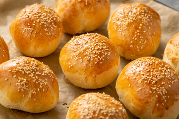 Homemade fresh bread buns with sesame seeds.