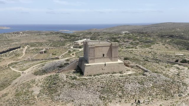 AERIAL Circling Saint Mary’s Battery Tower On Comino Island, Malta