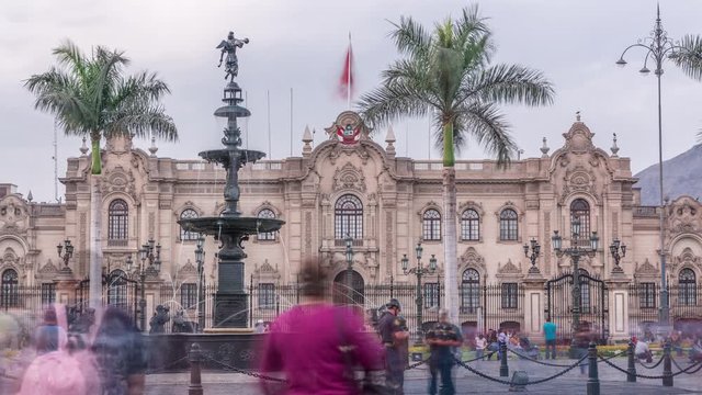 Fountain on The Plaza de Armas timelapse, also known as the Plaza Mayor, sits at the heart of Lima's historic center. Goverment palace on a background