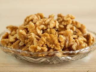 plate with walnuts in the foreground