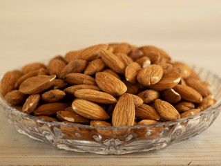 plate with almonds in the foreground