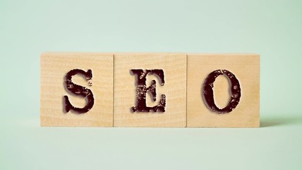 Seo word collected of wooden blocks elements with letters business concept blue background zoom in - Powered by Adobe