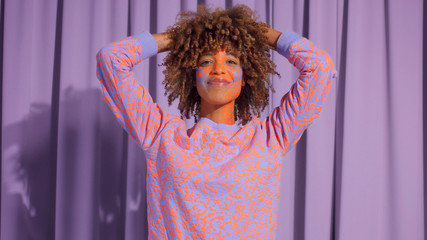 Closeup portrait of mixed race woman with neon makeup . new beauty concept, authentic identity Happy smiling new identity model