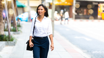 Attractive young aged business woman. Smiling female professional manager at modern place. corporate woman in co working space..