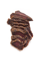 Beef Biltong, South African Beef Jerky isolated on a white studio background.