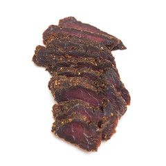 Beef Biltong, South African Beef Jerky isolated on a white studio background.