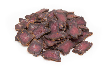 Beef Biltong, South African Beef Jerky isolated on a white studio background.