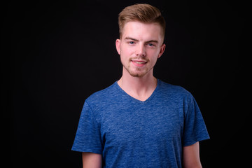 Fototapeta premium Portrait of young handsome blond bearded man