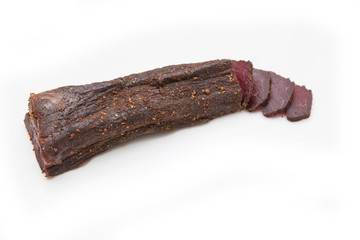 Beef Biltong, South African Beef Jerky isolated on a white studio background.