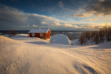 View of amazing Lofoten Islands winter scenery with mountains and fiords in beautiful golden morning light at sunrise, Norway