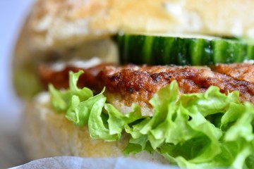 Gourmet meat sandwich with cucumber and lettuce 