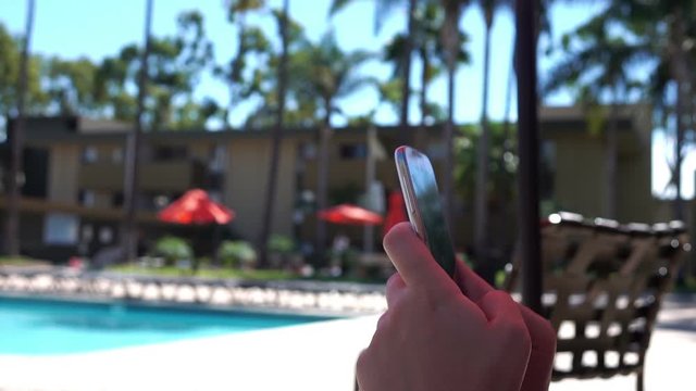 Woman using phone on the vacations in slow motion 120fps