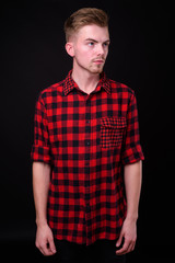 Obraz premium Portrait of young handsome blond bearded hipster man
