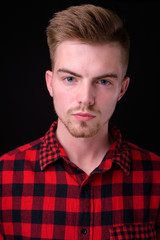 Fototapeta premium Portrait of young handsome blond bearded hipster man